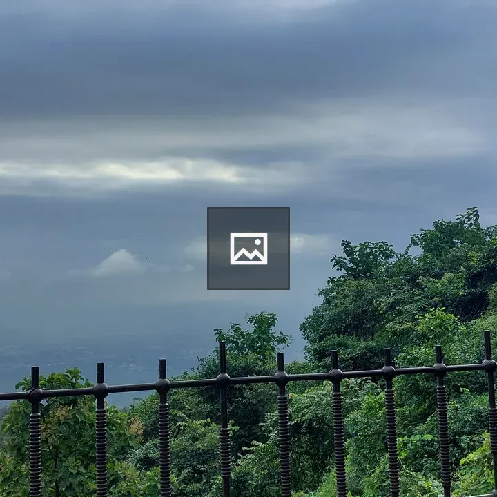Scenic cloudy hillside with lake