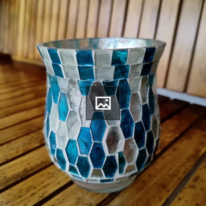 A mosaic candle holder