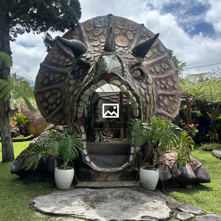 Horned Dinosaur Head Sculpture Entrance
