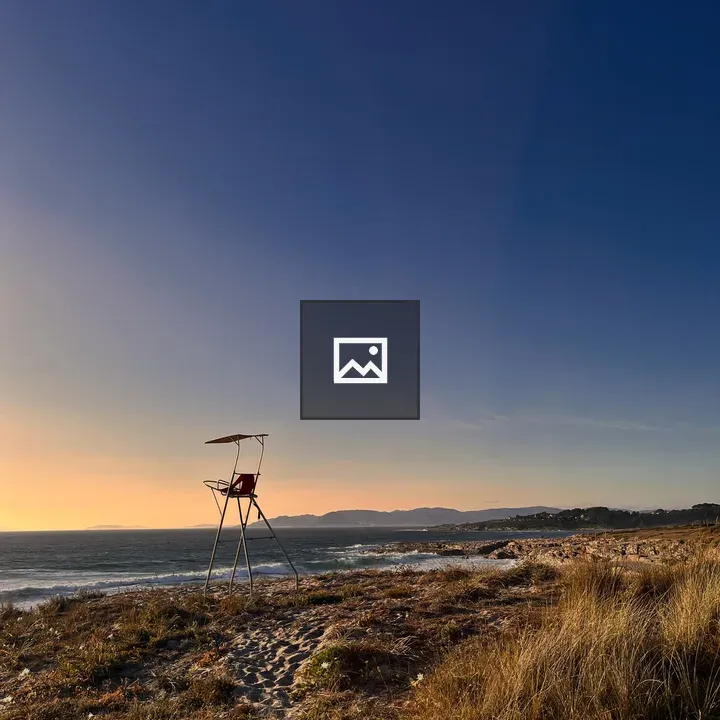 Empty lifeguard chair on beach