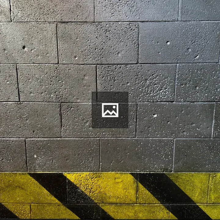 Cinder block wall with yellow stripe
