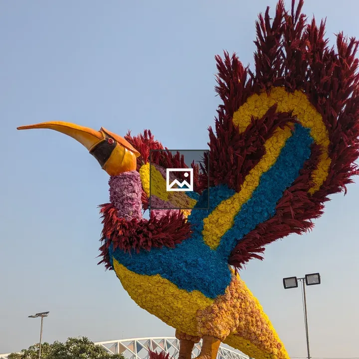 Floral bird sculpture in garden