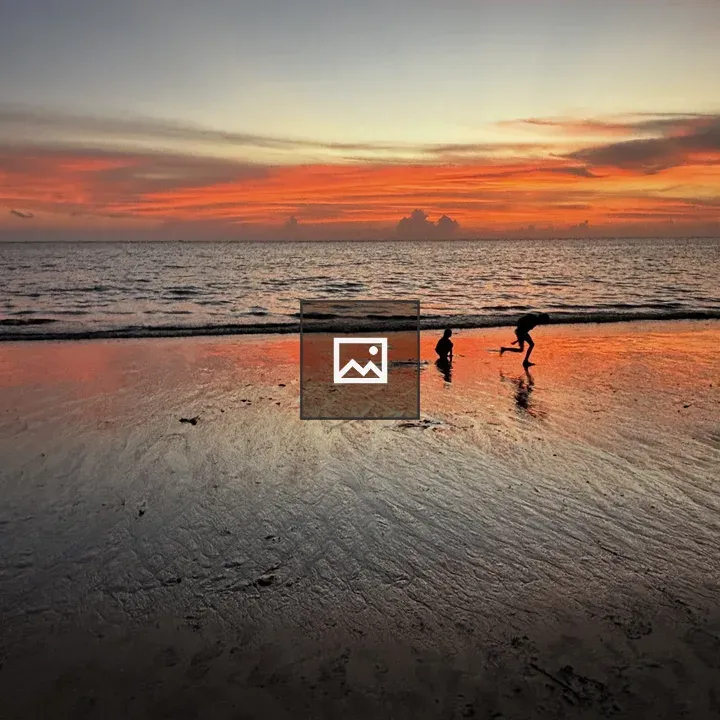 Children Running on Beach at Dusk