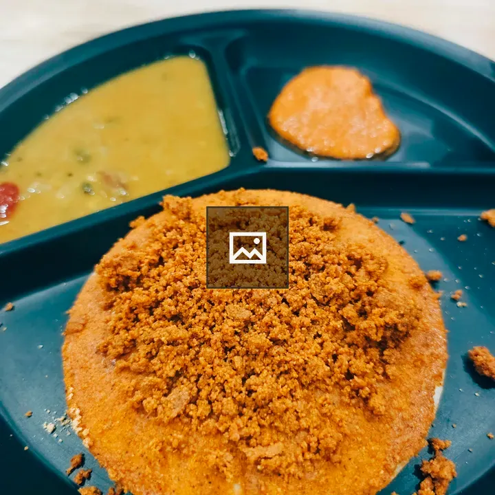Ghee podi idli on black plate