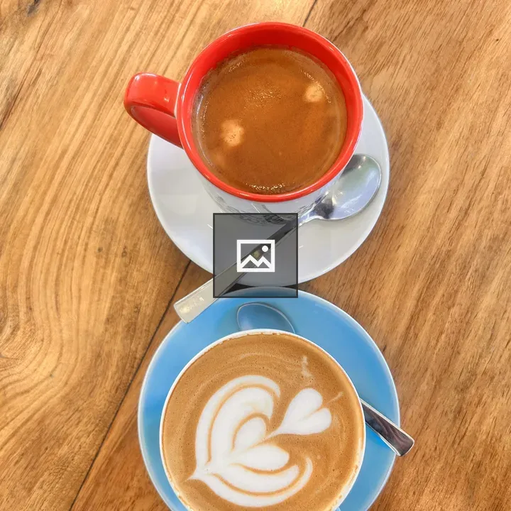 Two cups of coffee on table