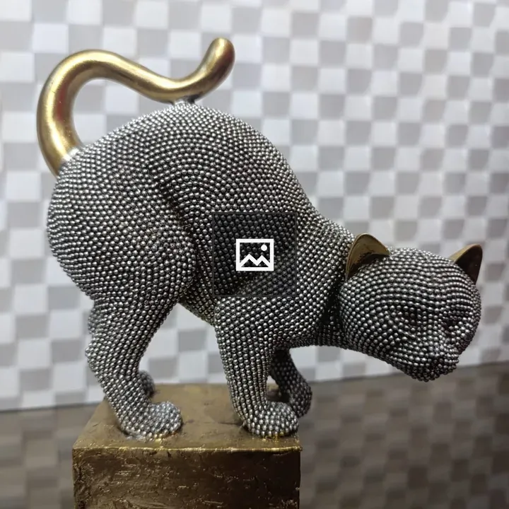 Leaning metal cat sculpture