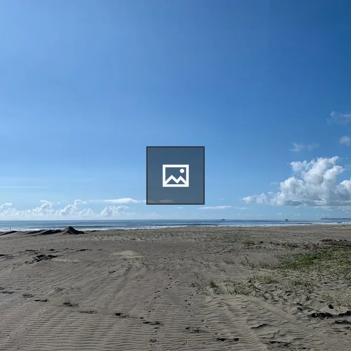Beach under blue sky