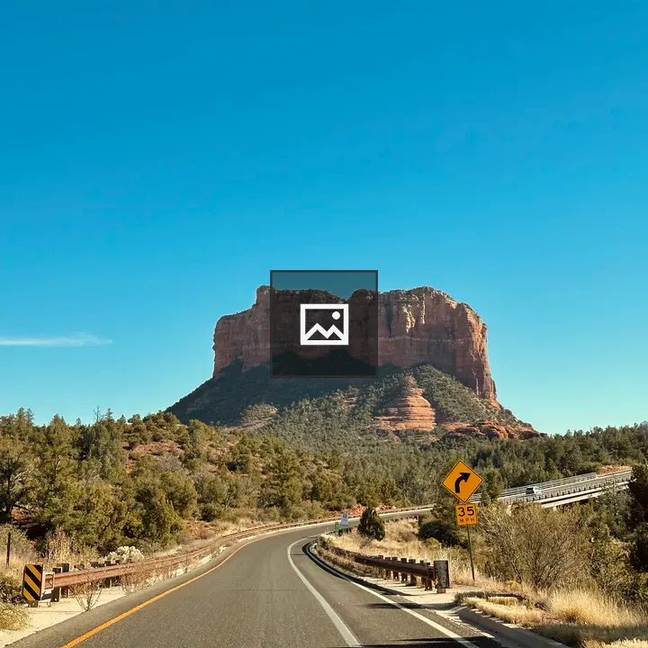 Paved highway through desert valley