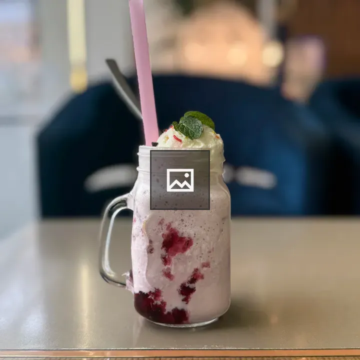 Strawberry milkshake in mason jar