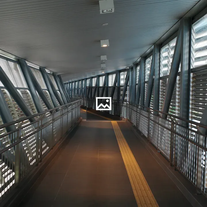 Walkway with railing and yellow line