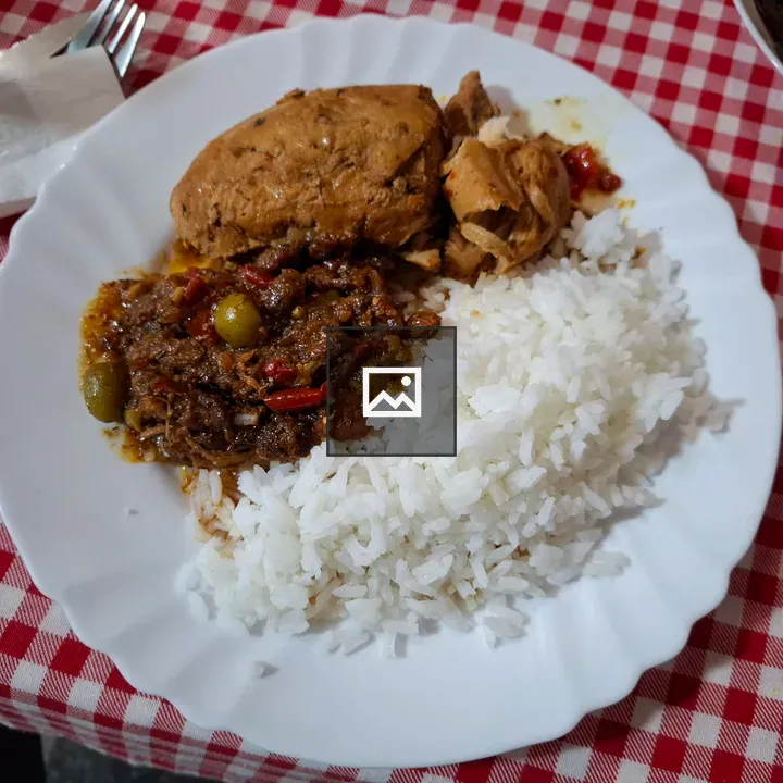 Rice and chicken in gravy dish