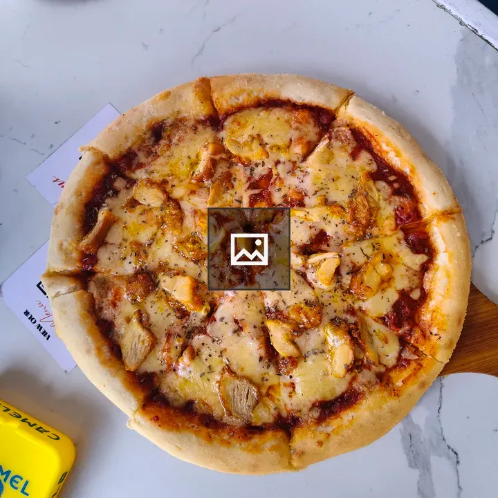 Pizza on Wooden Board
