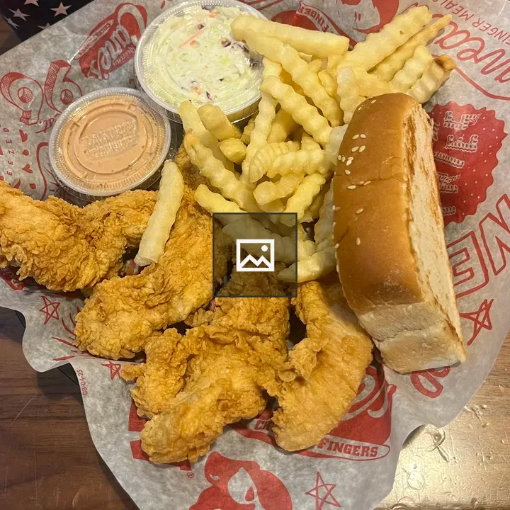 Plate of crispy chicken tenders and fries