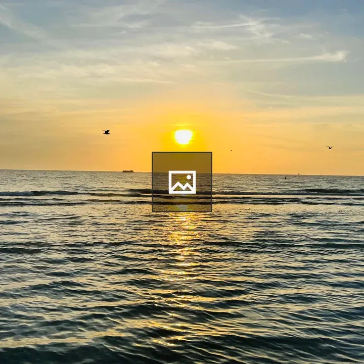 Sunset over calm ocean