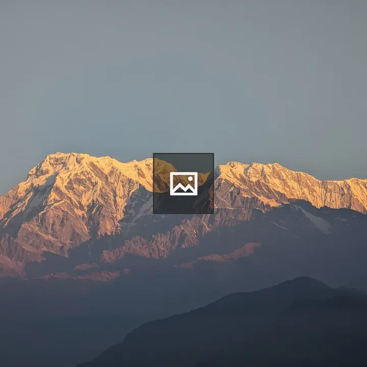 Snow-Capped Peaks in Golden Light