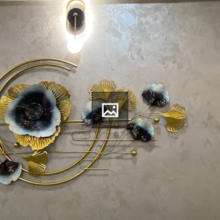 Decorative wall art with golden floral shapes