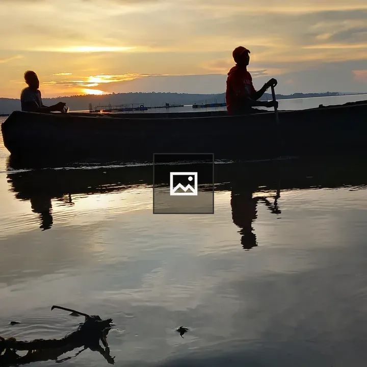Silhouettes of Fishermen on Lake Victoria