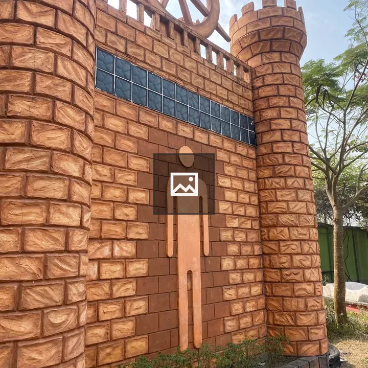 Brick tower wall with wheel