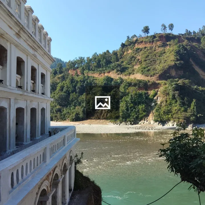 White Stone Building by River