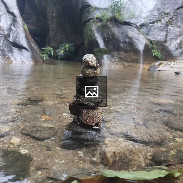 Stack of Balanced Stones in Stream