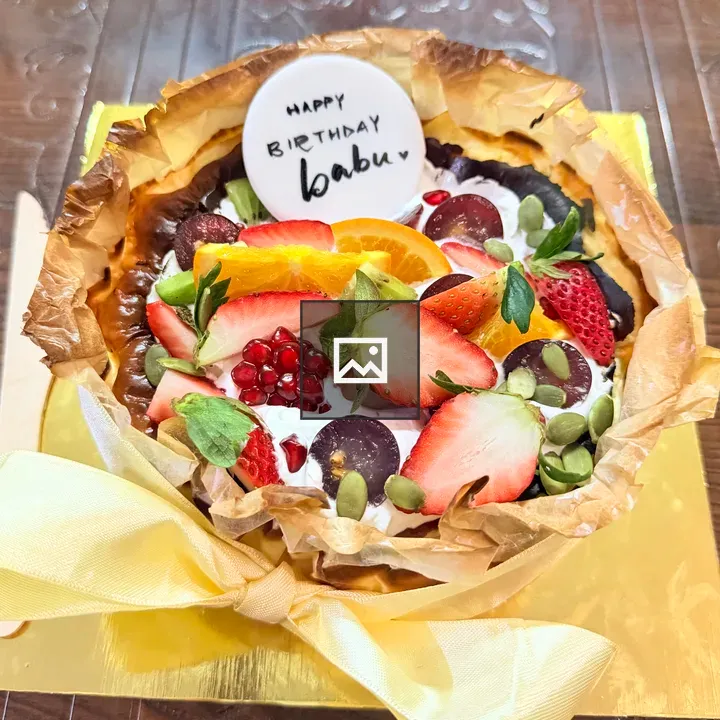 Round birthday cake with fresh fruit
