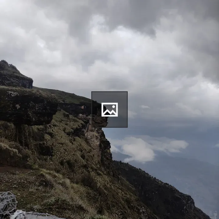Cliff Edge with Cloudy Sky