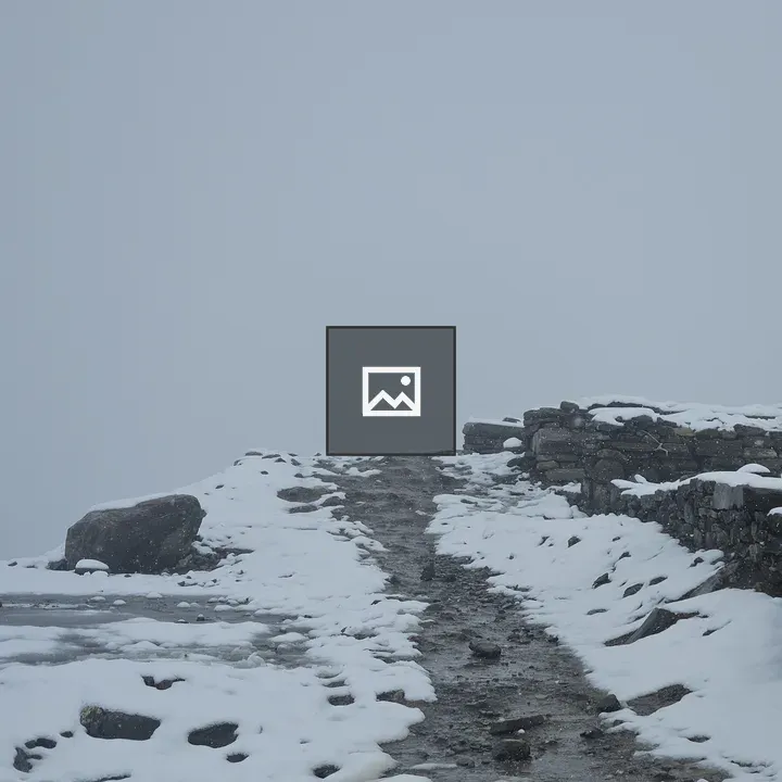 Snowy Path Through Rocks and Walls