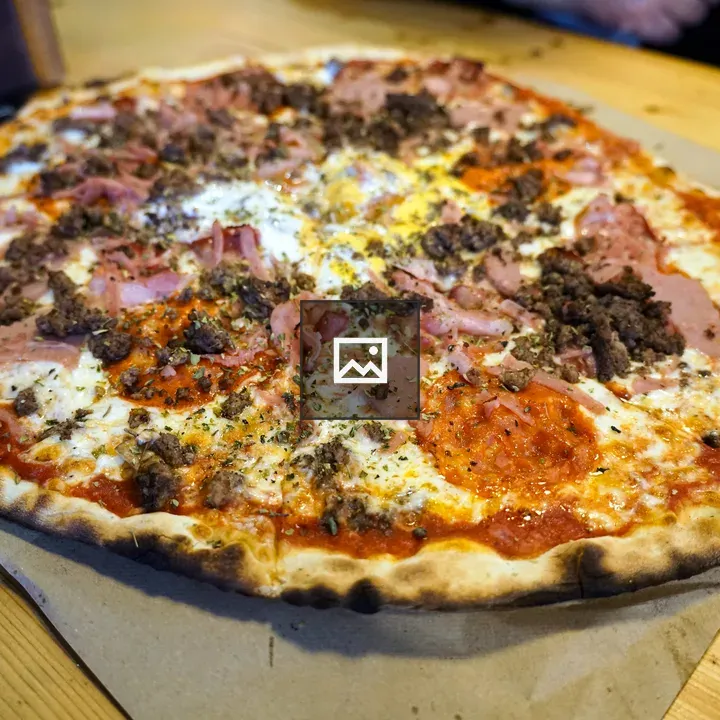 Pizza with ham and beef