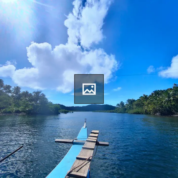 Traditional wooden boat on blue water