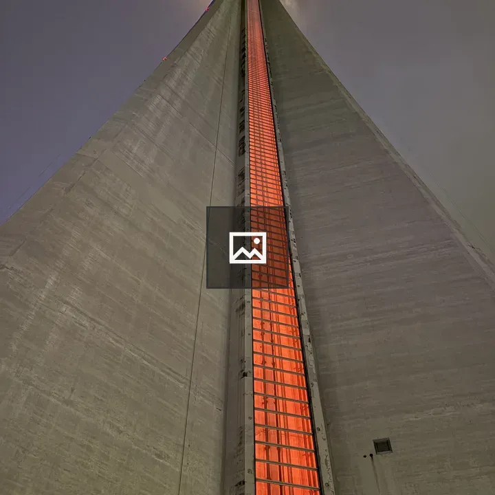 Tall illuminated tower at night
