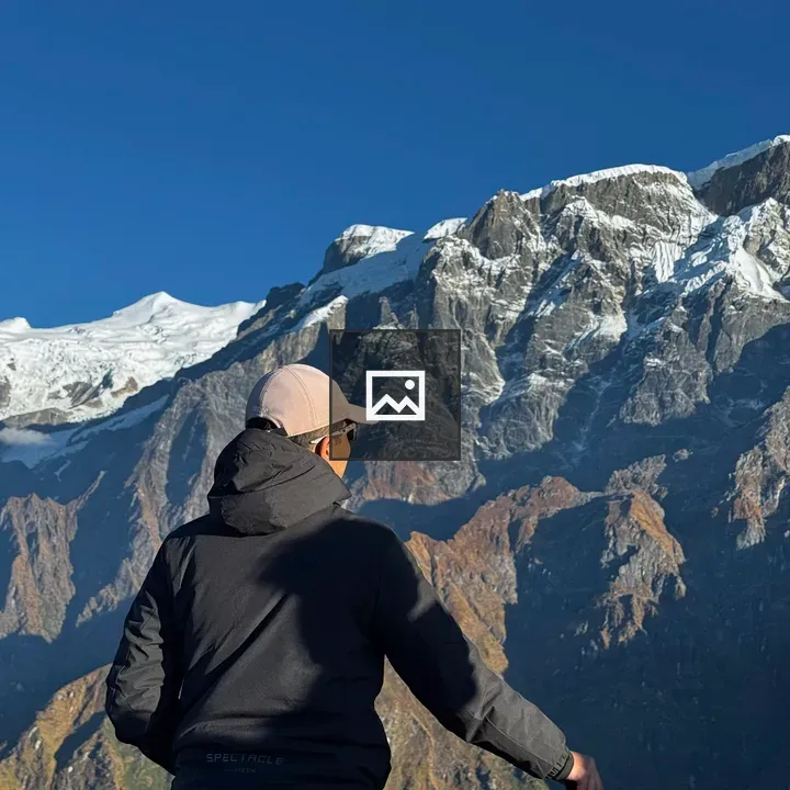 Person Overlooking Mountain Landscape