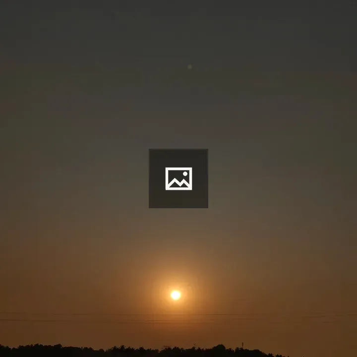 Orange Sun Against Dark Sky