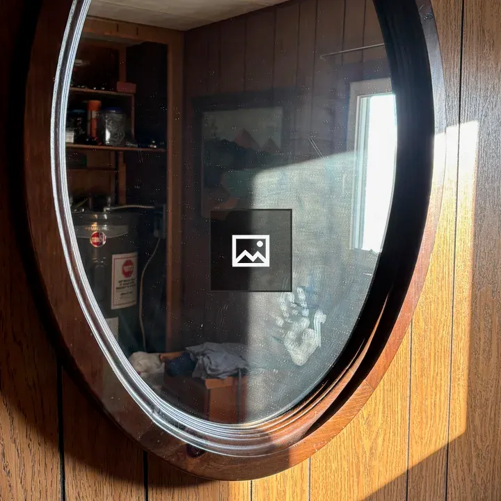 Oval mirror with sunlit square