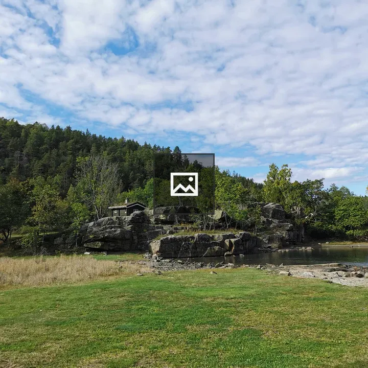 Grass, rocks, water and sky
