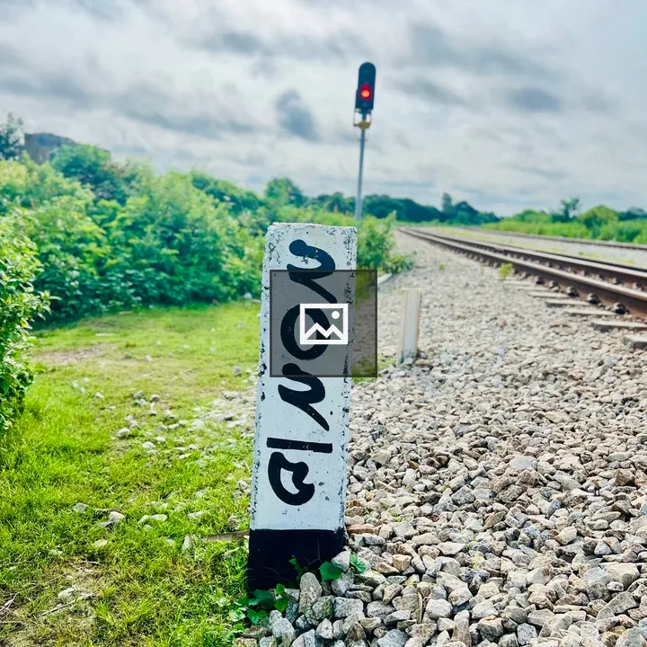 Railway marker post with Bengali script