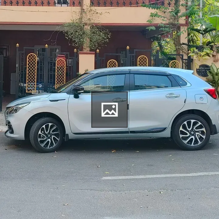 Silver hatchback on residential street