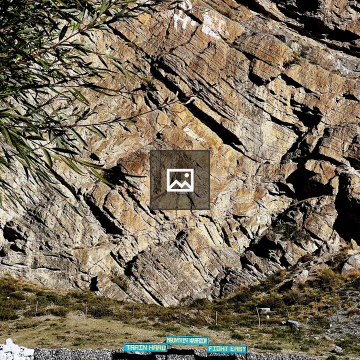 Rocky Cliff with Blue Signs