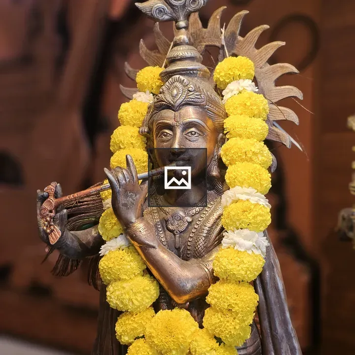Krishna statue playing flute