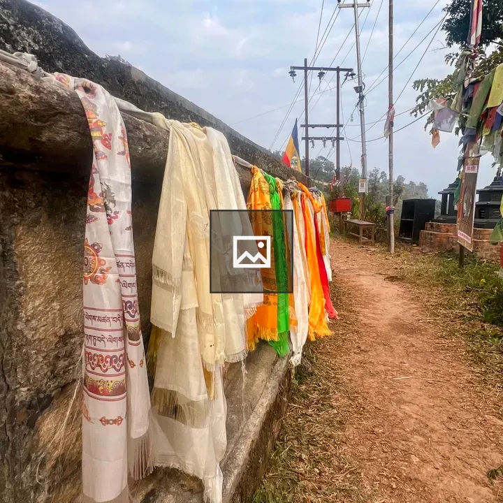 Colorful prayer scarves on wall