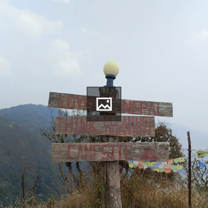 Rustic signpost with hills