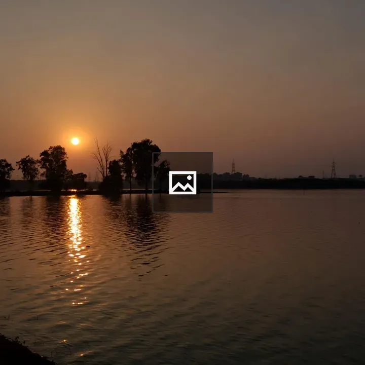 Sunset Over Water with Silhouettes