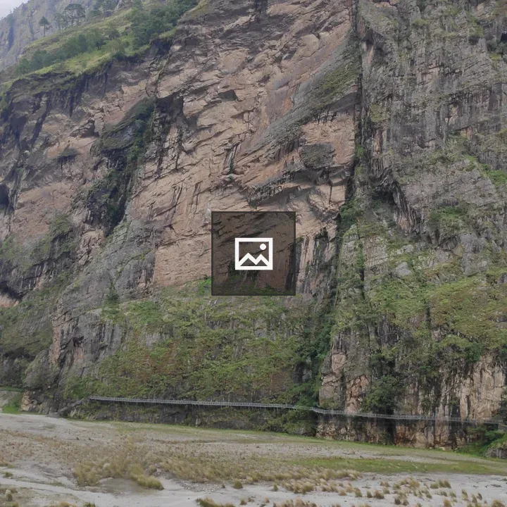 Rocky cliffside by river
