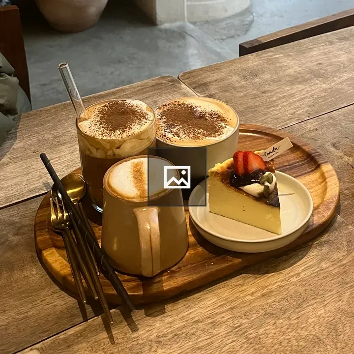 Wooden tray with coffee and dessert