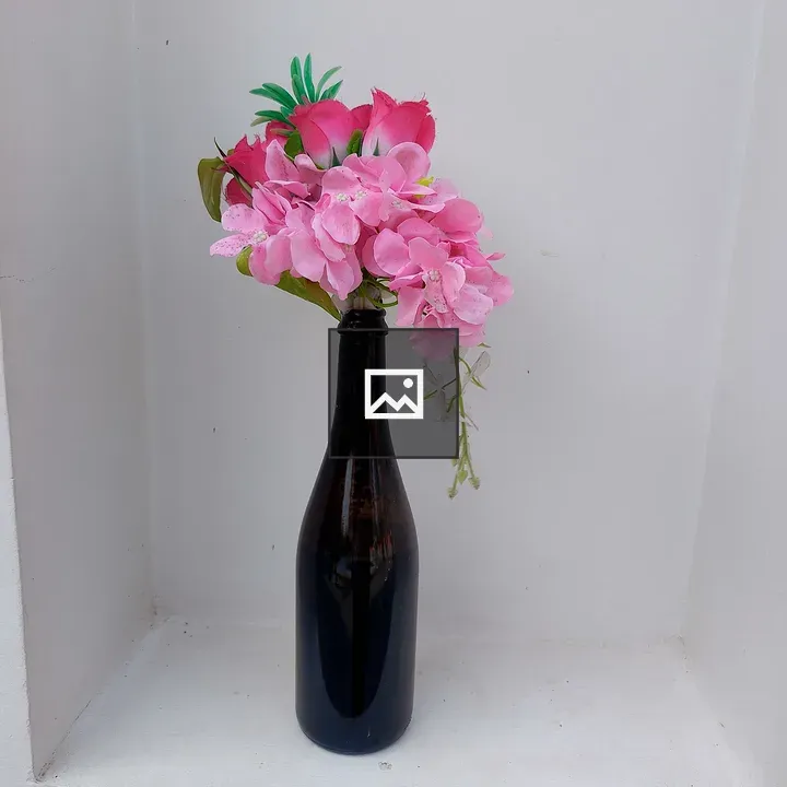 Dark bottle with pink floristry