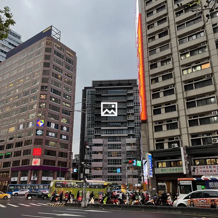Busy street with tall buildings