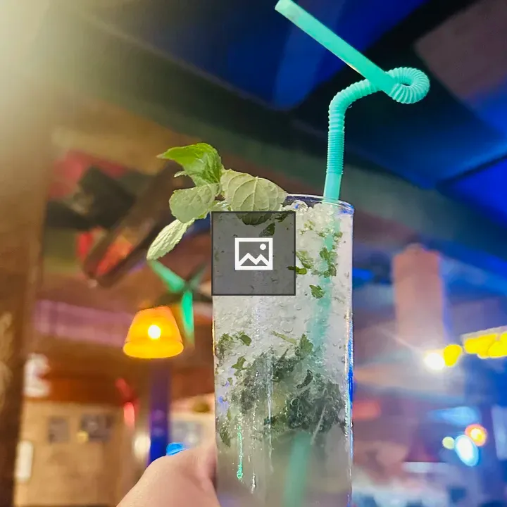 Holding Mojito Mocktail