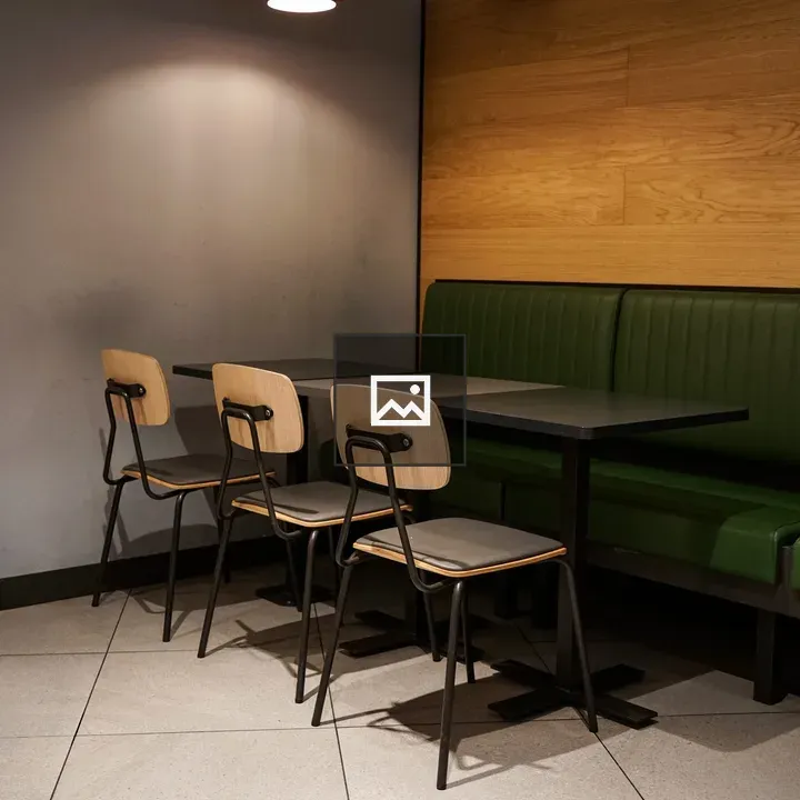 Cozy dining area with green booth