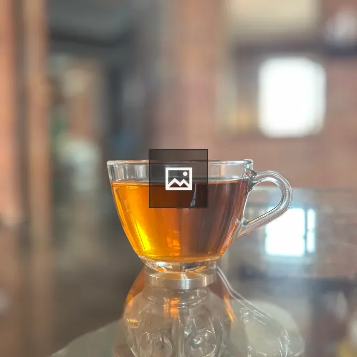 Glass cup of amber tea