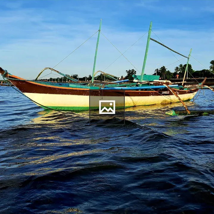 Wooden boat with outriggers