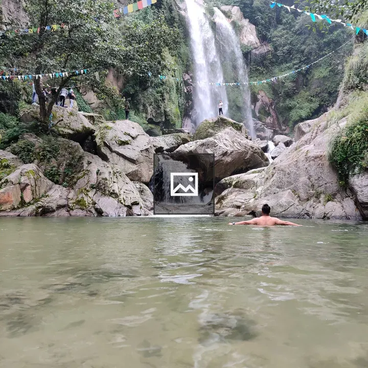 Waterfall Scene with Prayer Flags